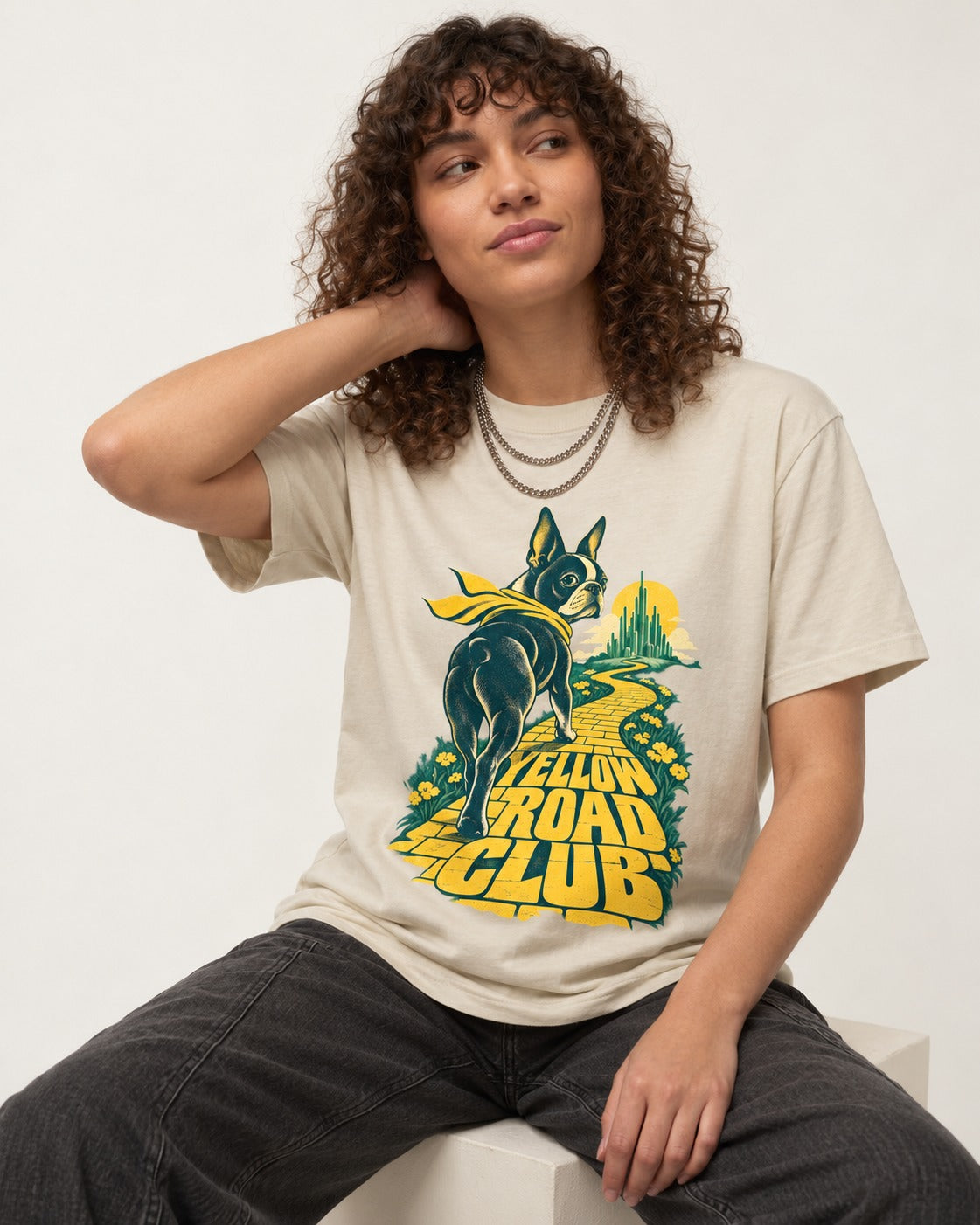 Boston Terrier Yellow Road Club T-Shirt in Sand, worn by a seated model