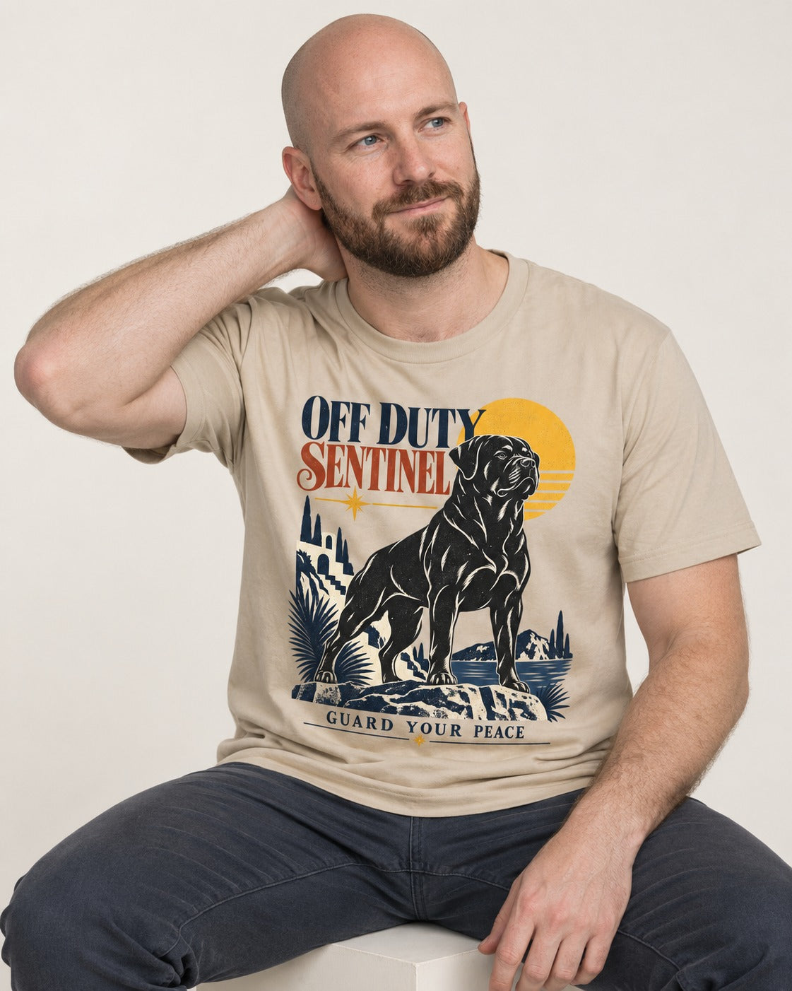 Off Duty Rottweiler Sentinel T-Shirt in Sand, worn by a seated model