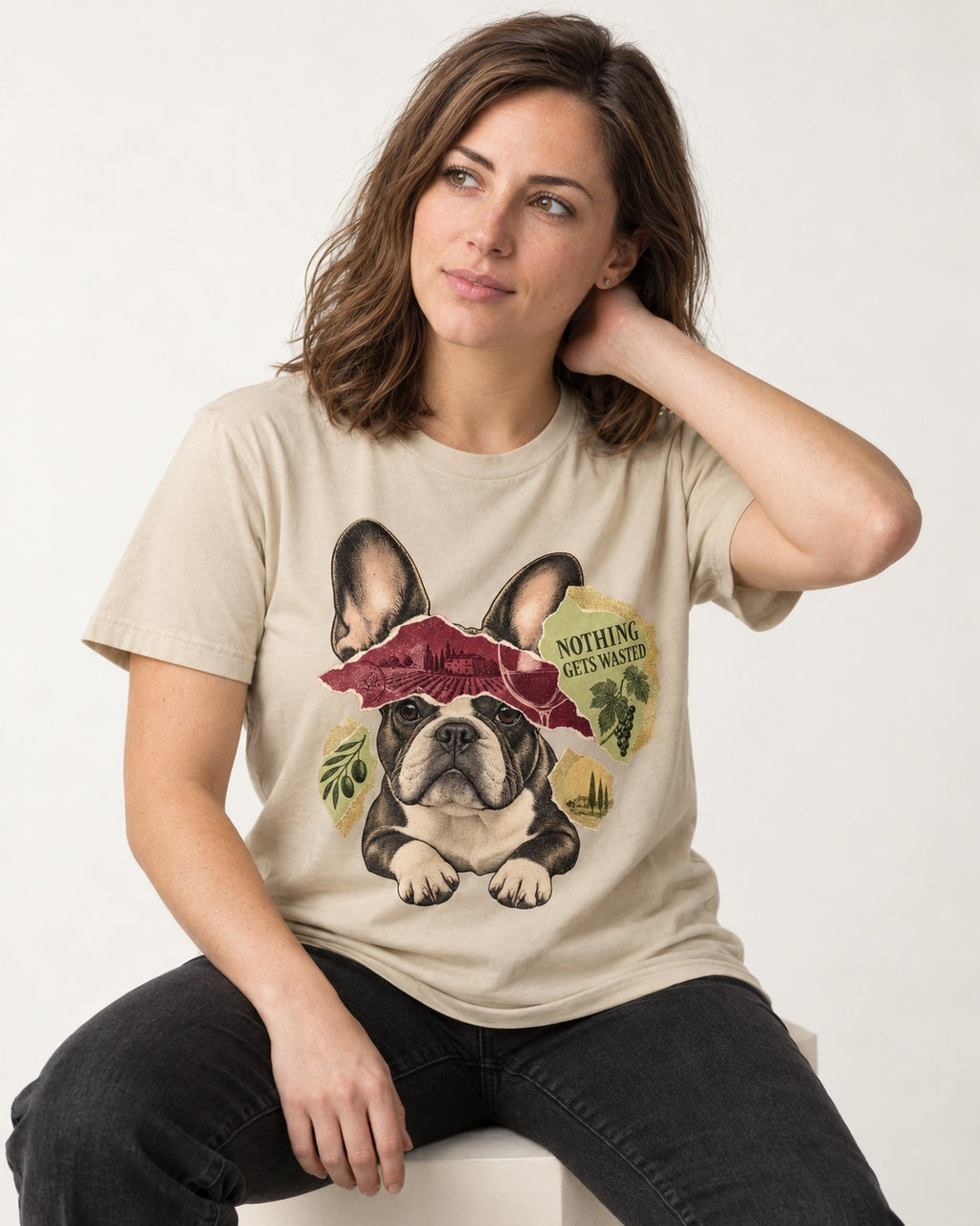 Nothing Gets Wasted with Frenchie T-Shirt in Sand, worn by a seated model