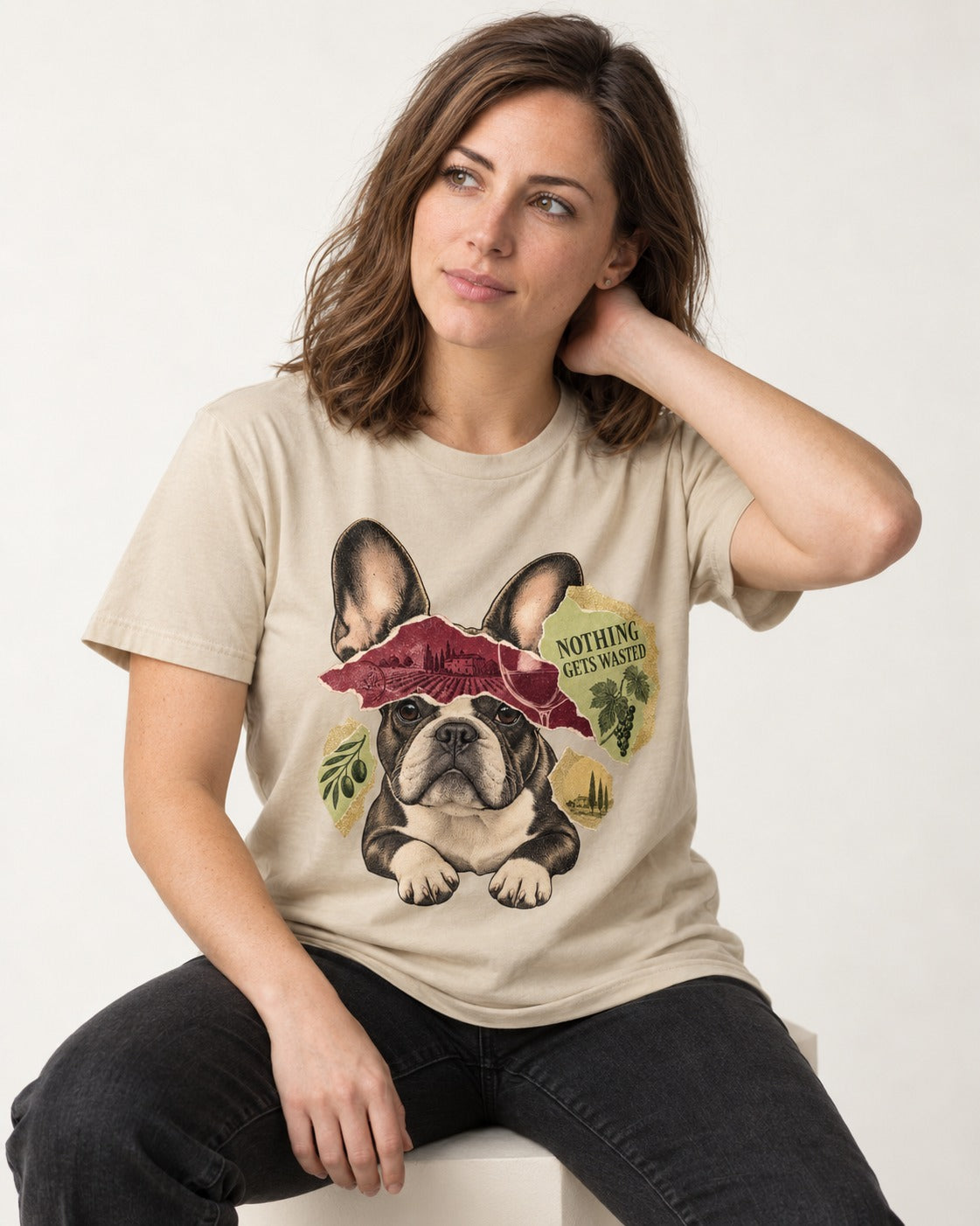 Nothing Gets Wasted with Frenchie T-Shirt in Sand, worn by a seated model