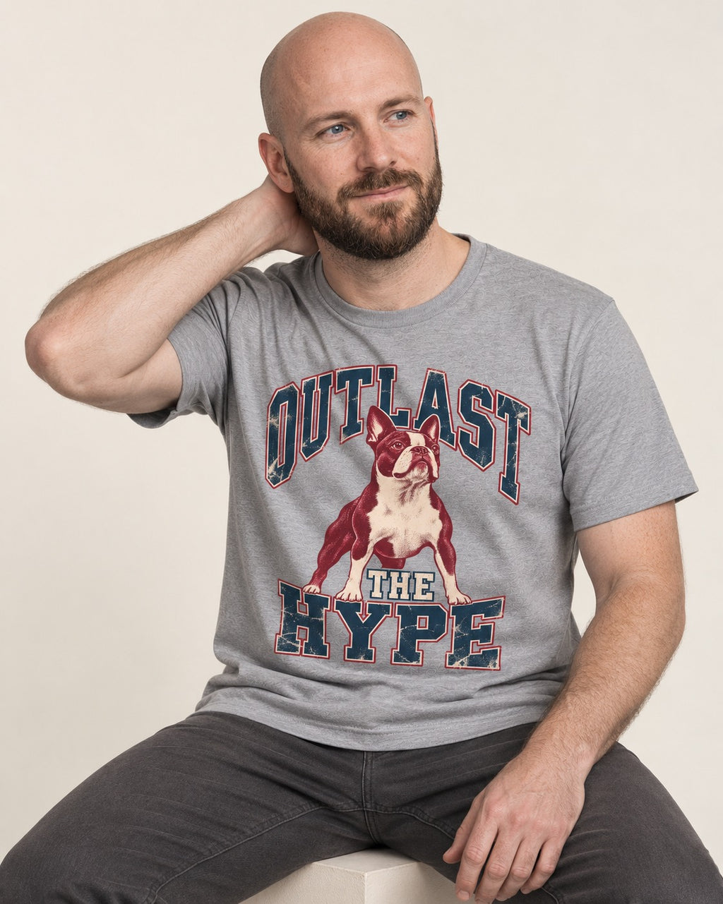 Boston Terrier Outlast The Hype Collegiate Graphic T-Shirt in Sport Grey, worn by a seated model