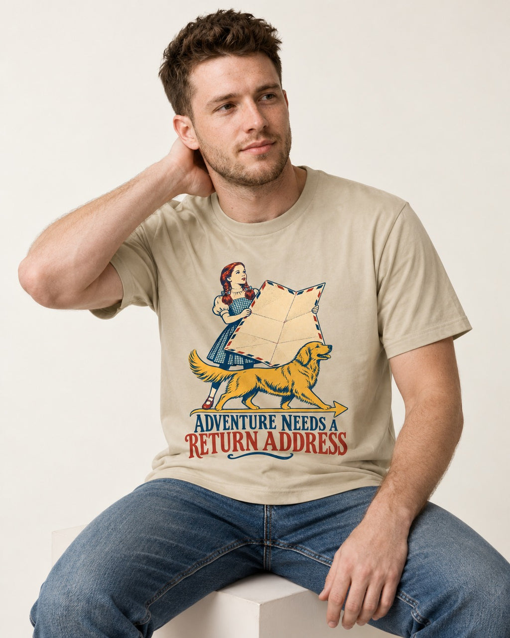 Golden Retriever Return Address T-Shirt in Sand, worn by a seated model