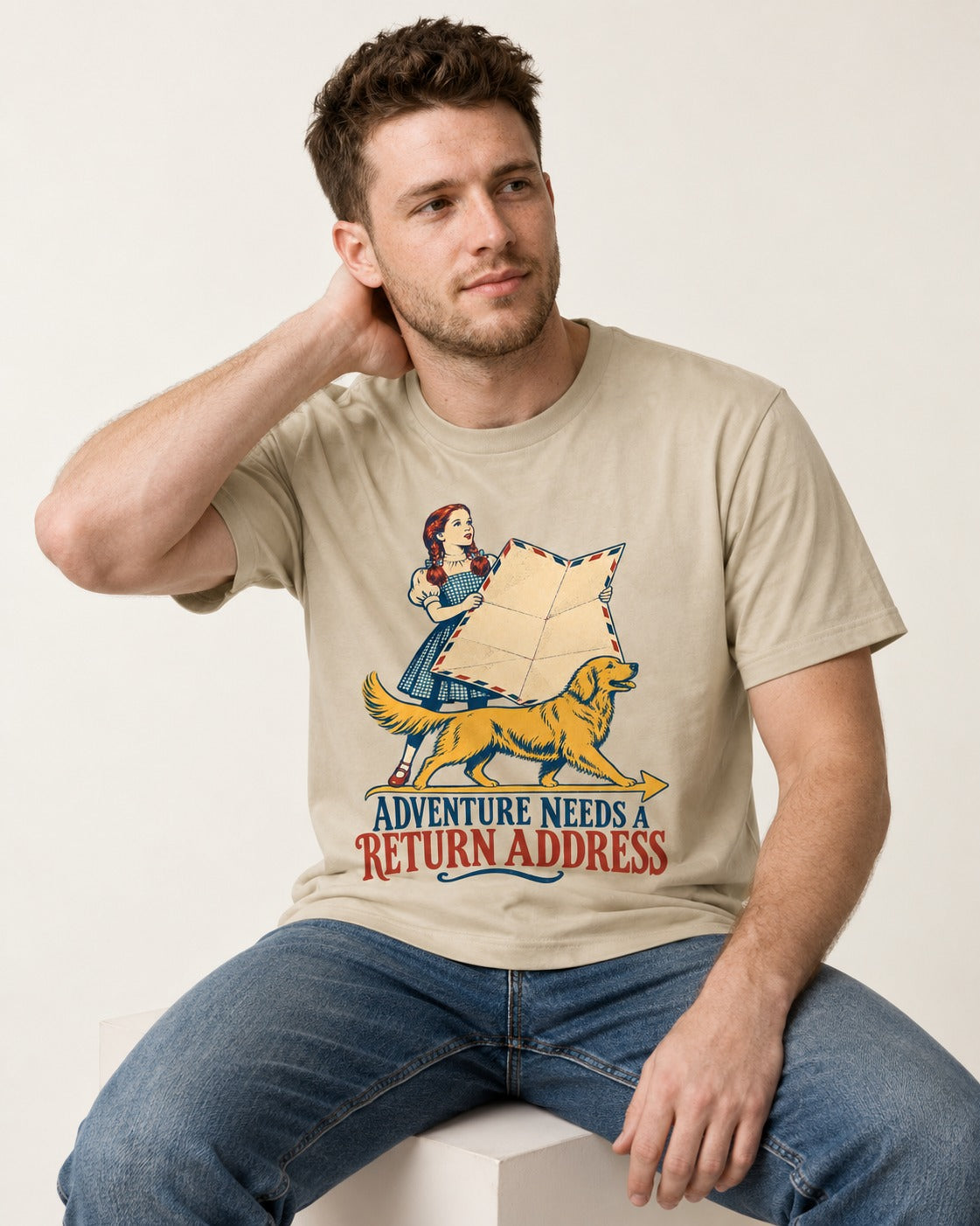 Golden Retriever Return Address T-Shirt in Sand, worn by a seated model