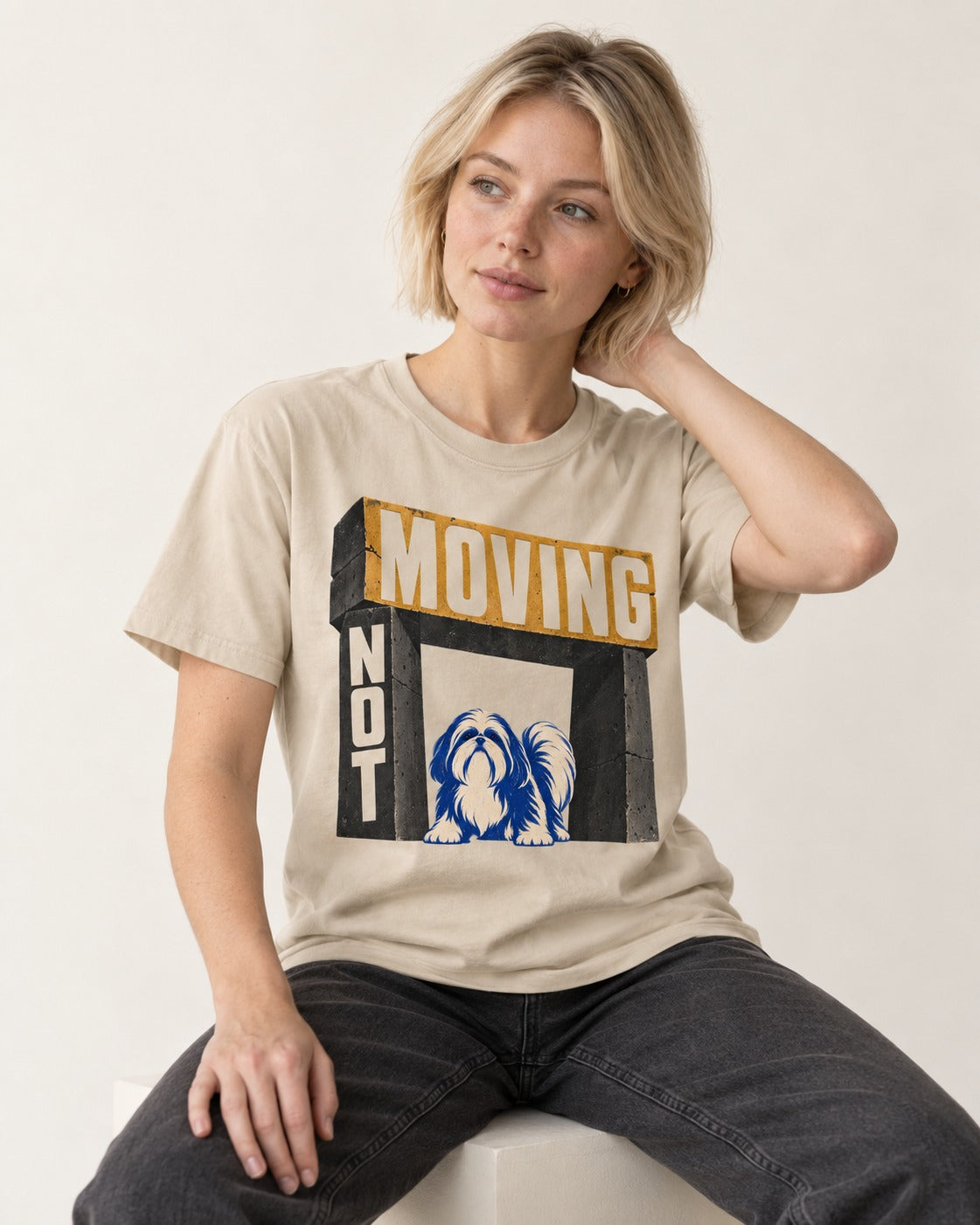 Not Moving Shih Tzu T-Shirt in Sand, worn by a seated model