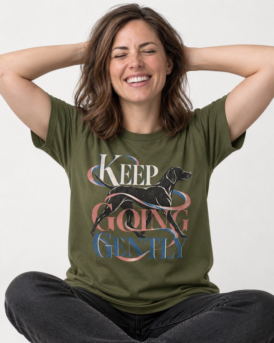 German Shorthaired Pointer Keep Going Gently Walking Graphic T-Shirt in Heather Military Green, worn by a seated model