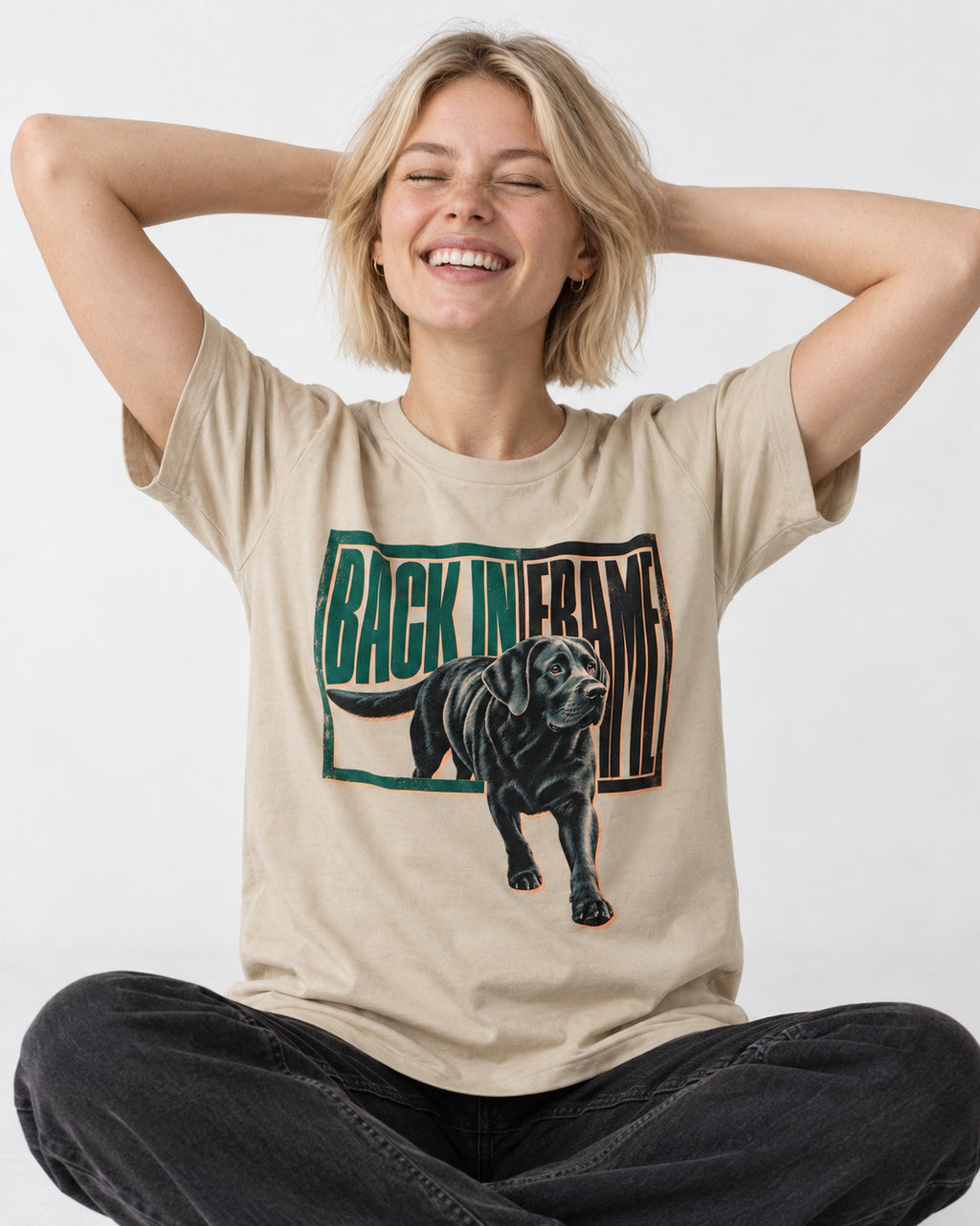 Labrador Retriever Back in Frame T-Shirt in Sand, worn by a seated model