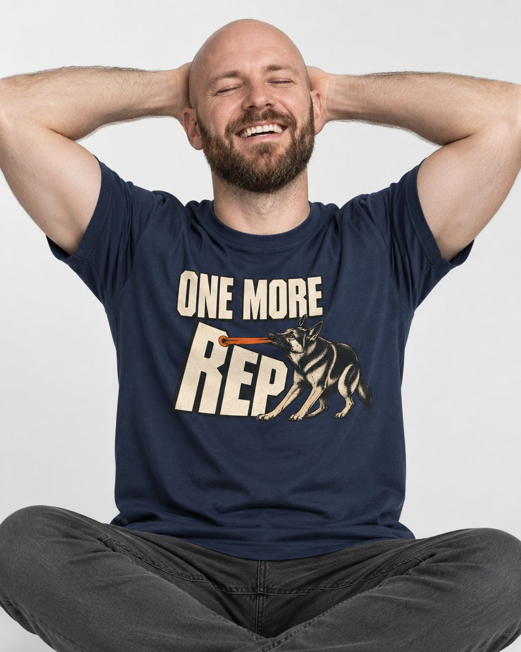 One More Rep Tug German Shepherd Dog Graphic T-Shirt in Navy, worn by a seated model