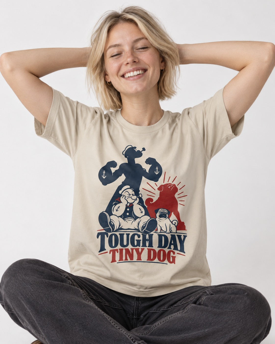 Tough Day Tiny Pug T-Shirt in Sand, worn by a seated model