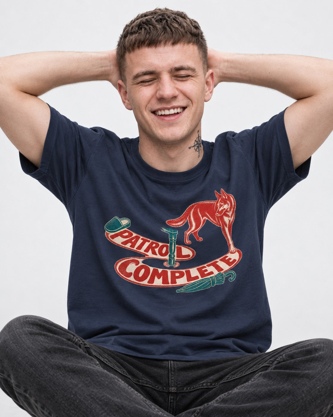 German Shepherd Dog Patrol Complete Umbrella Graphic T-Shirt in Navy, worn by a seated model