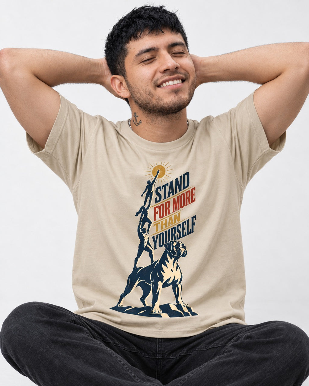 Boxer Stand for More T-Shirt in Sand, worn by a seated model