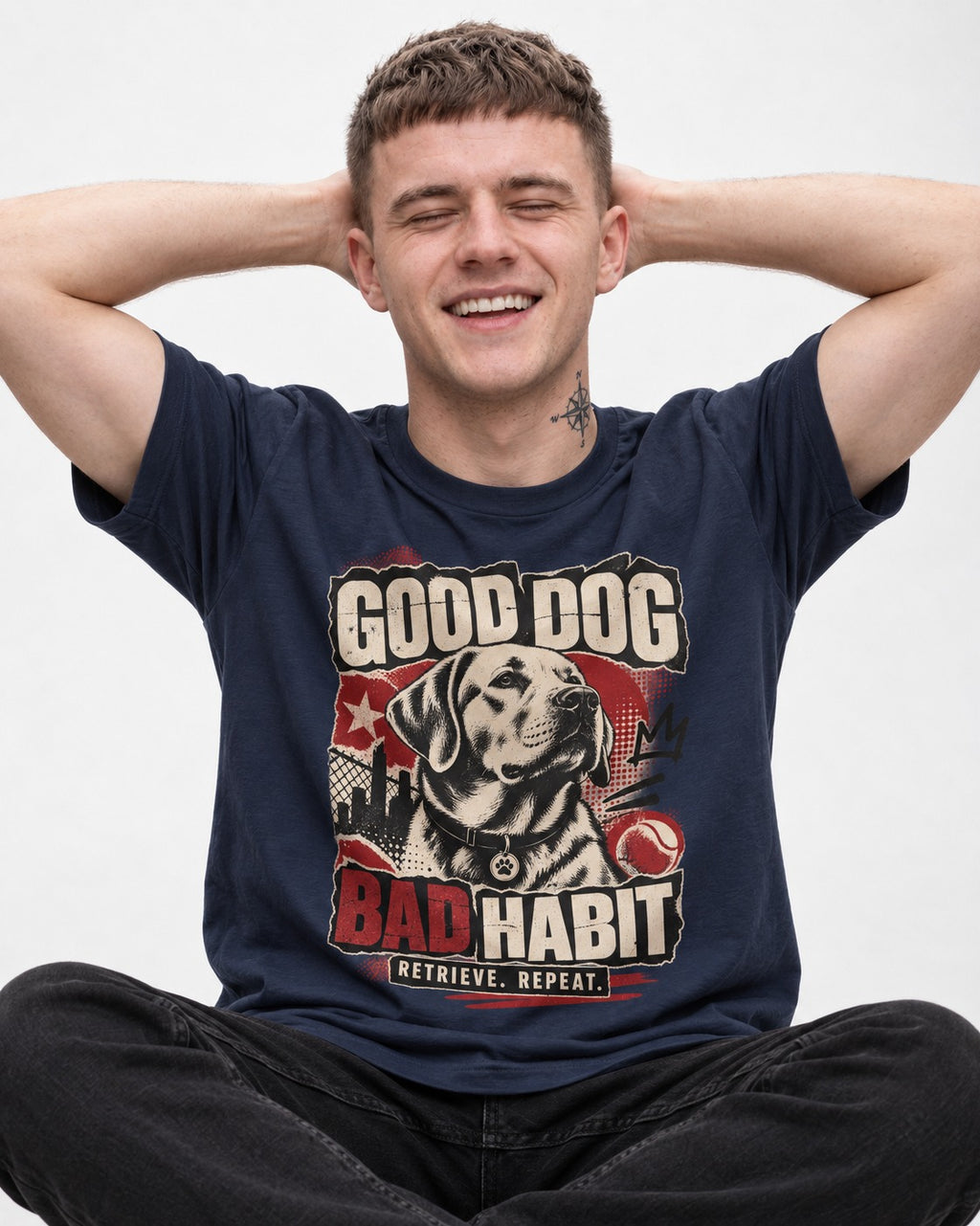 Labrador Retriever Good Dog Bad Habit Poster Graphic T-Shirt in Navy, worn by a seated model