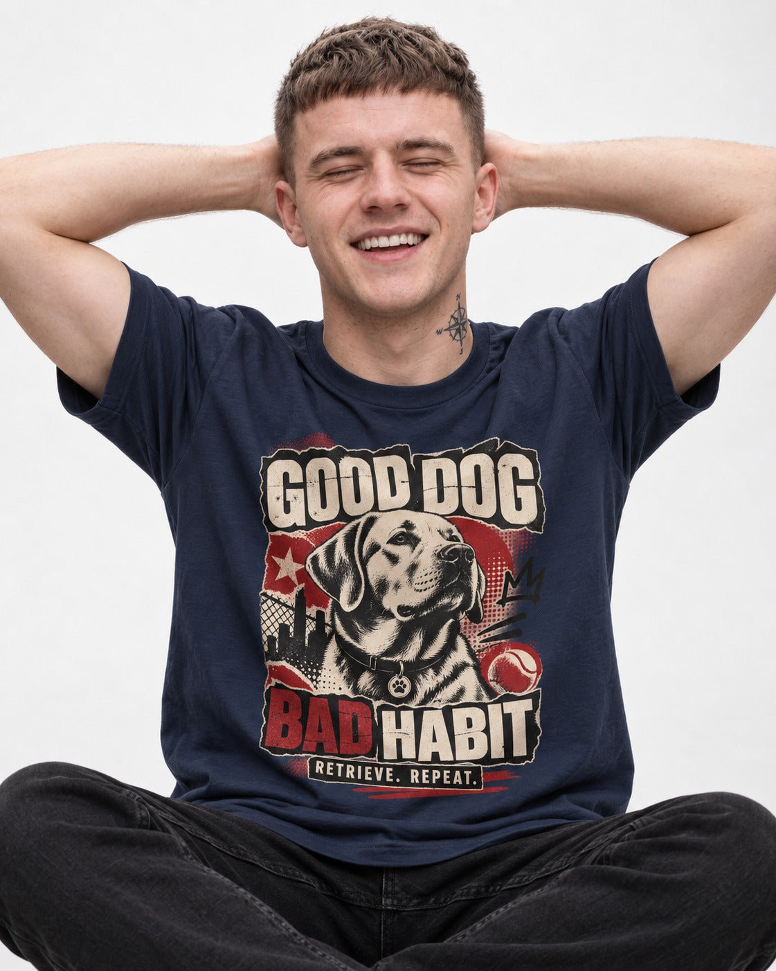 Labrador Retriever Good Dog Bad Habit Poster Graphic T-Shirt in Navy, worn by a seated model