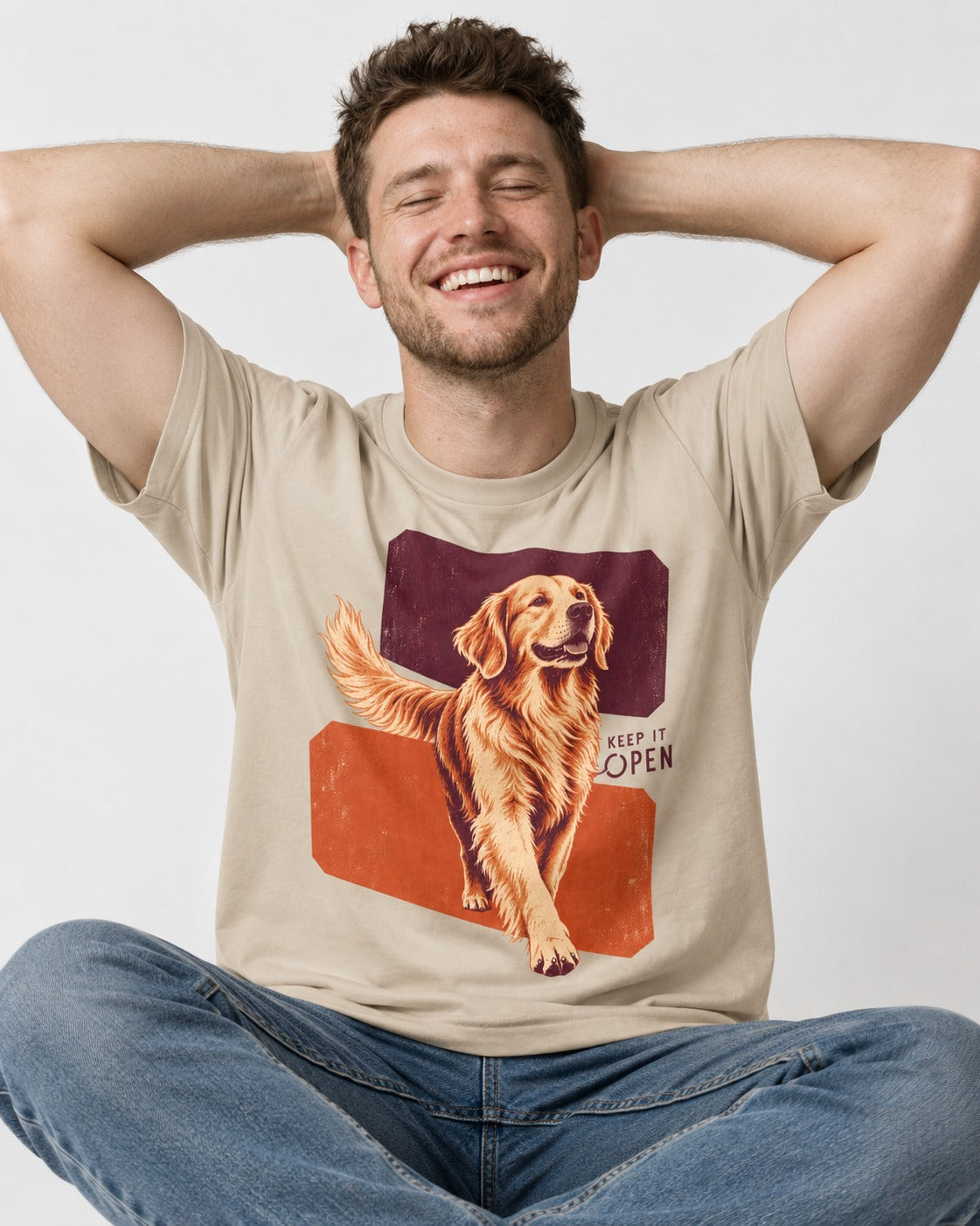 Golden Retriever Keep It Open T-Shirt in Sand, worn by a seated model