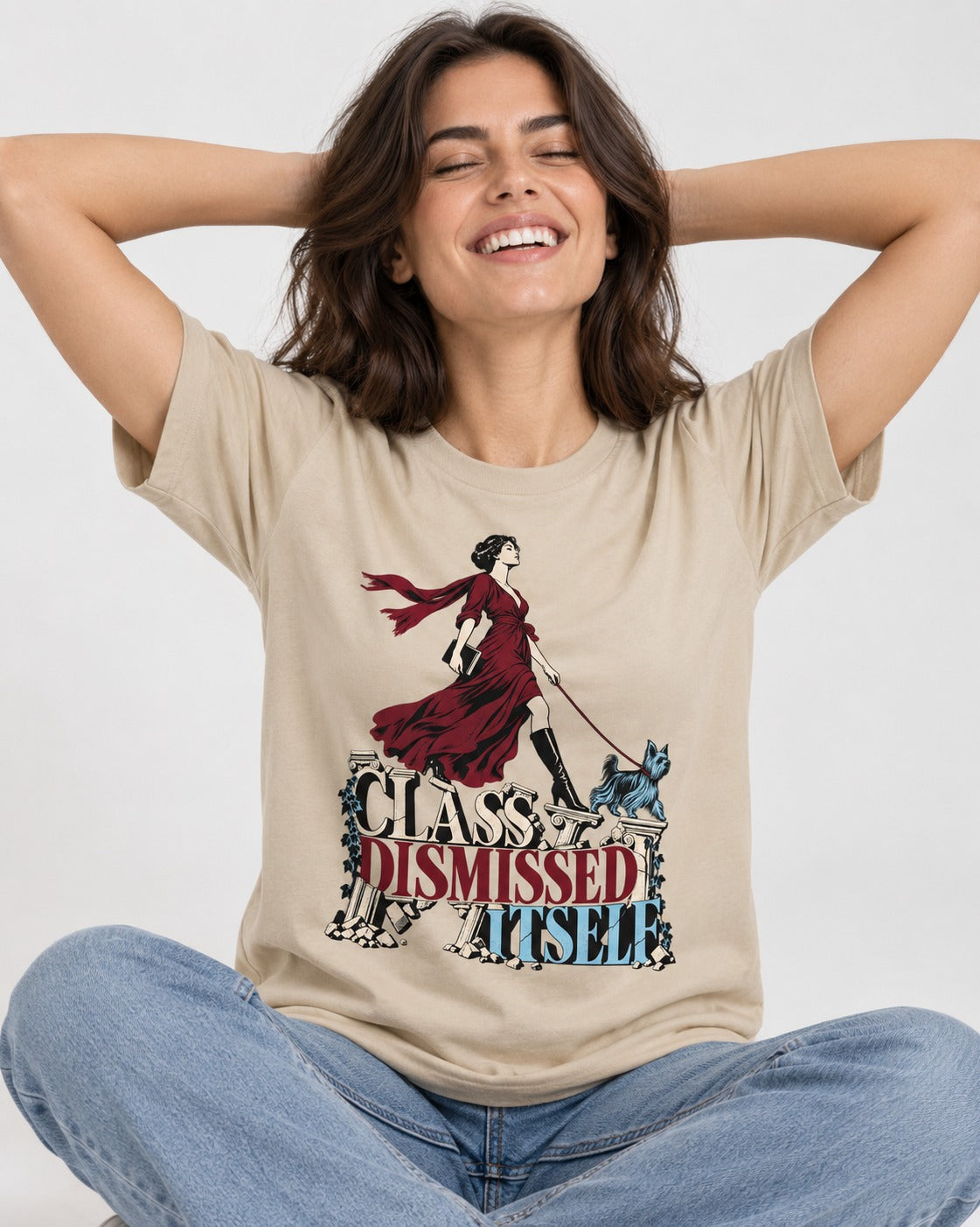 Class Dismissed Itself Yorkshire Terrier T-Shirt in Sand, worn by a seated model