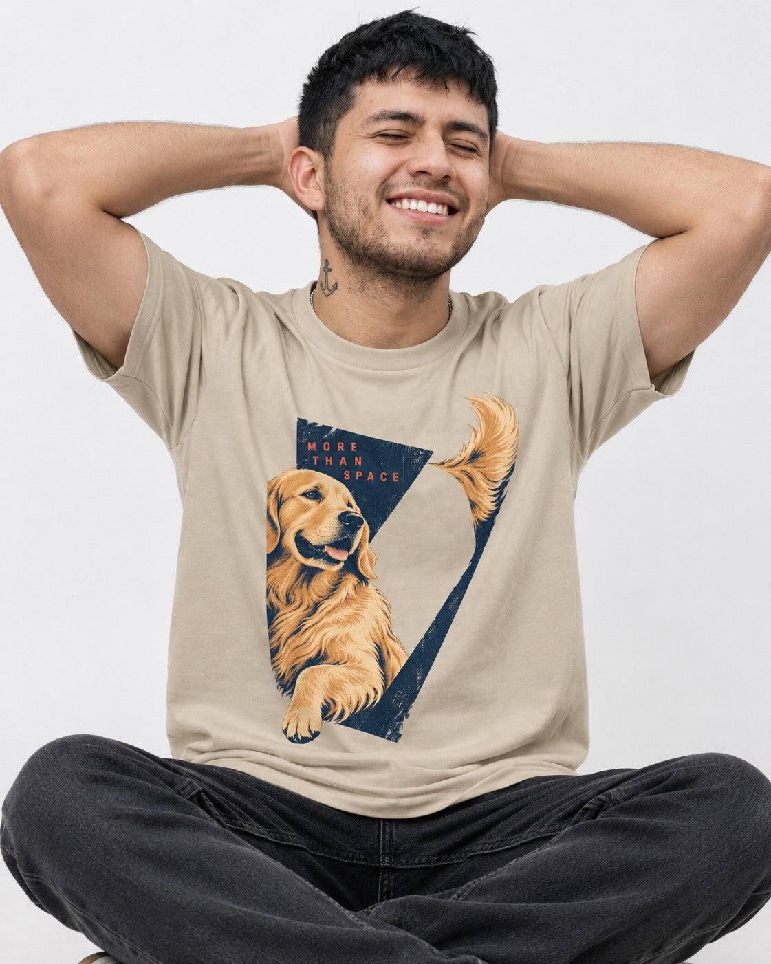 Golden Retriever More Than Space T-Shirt in Sand, worn by a seated model