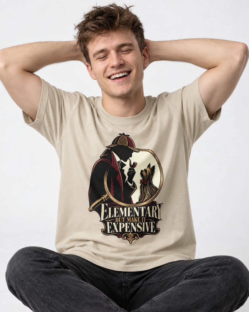 Elementary but Expensive Yorkshire Terrier T-Shirt in Sand, worn by a seated model