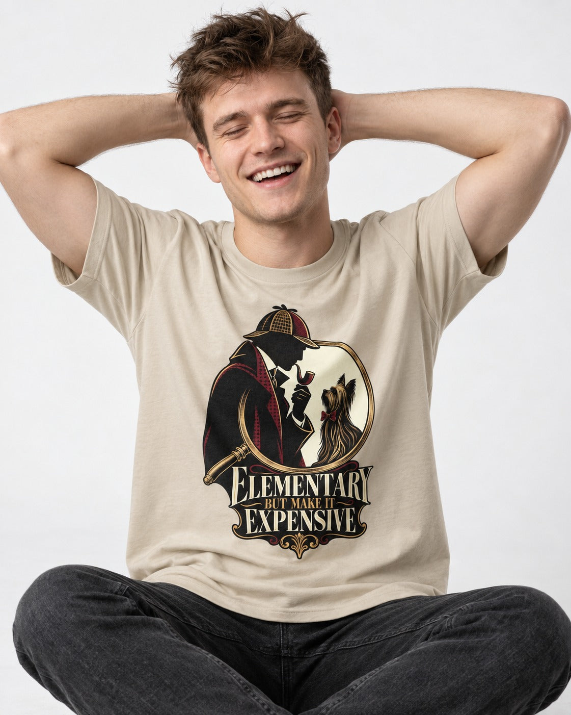 Elementary but Expensive Yorkshire Terrier T-Shirt in Sand, worn by a seated model