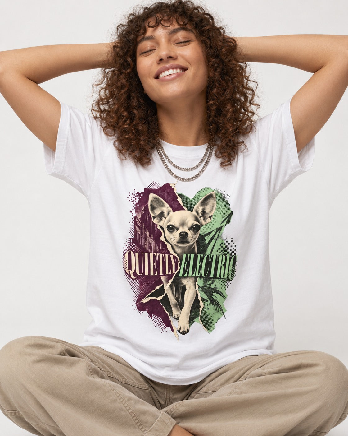Chihuahua Quietly Electric T-Shirt in White, worn by a seated model