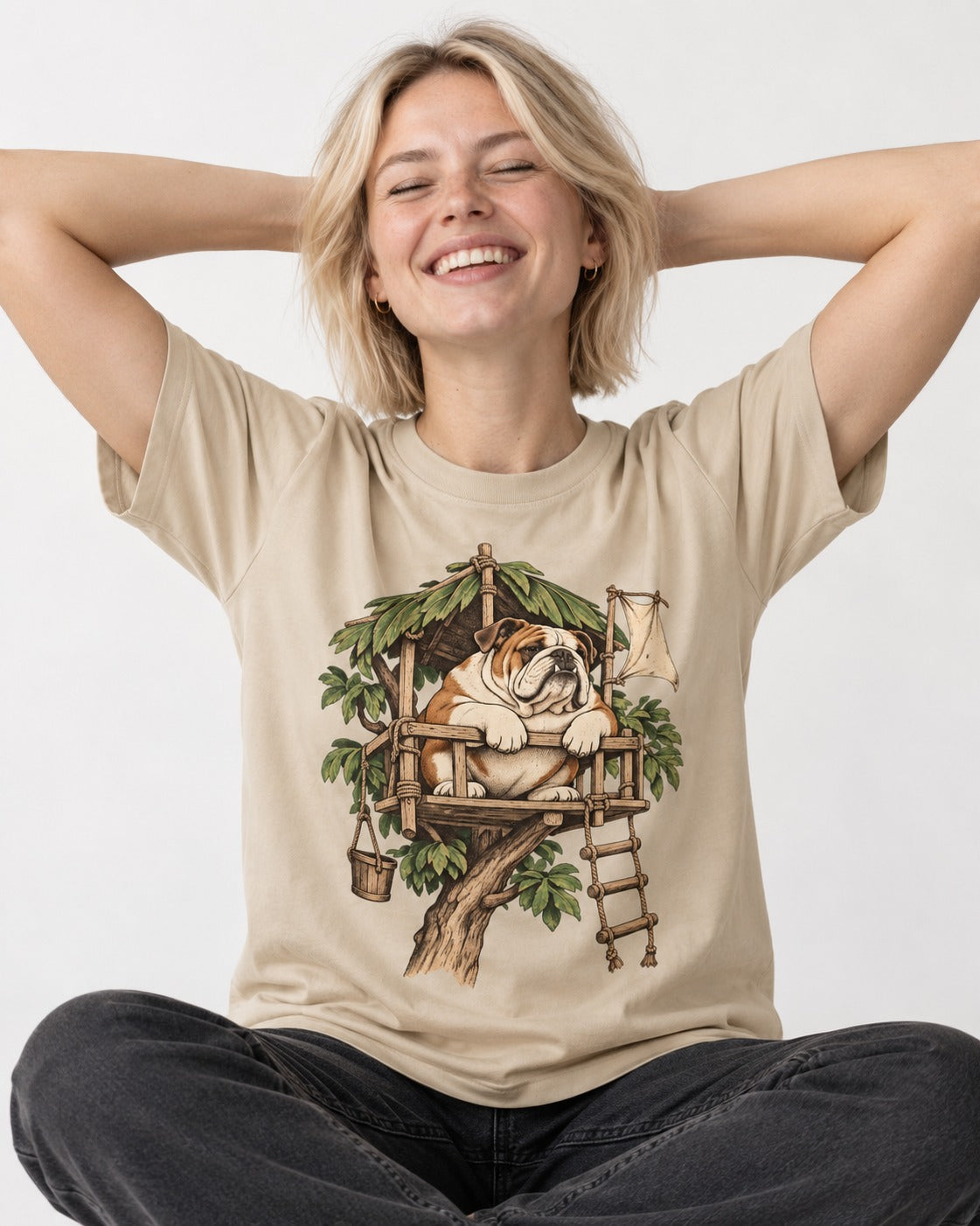English Bulldog Above It All T-Shirt in Sand, worn by a seated model