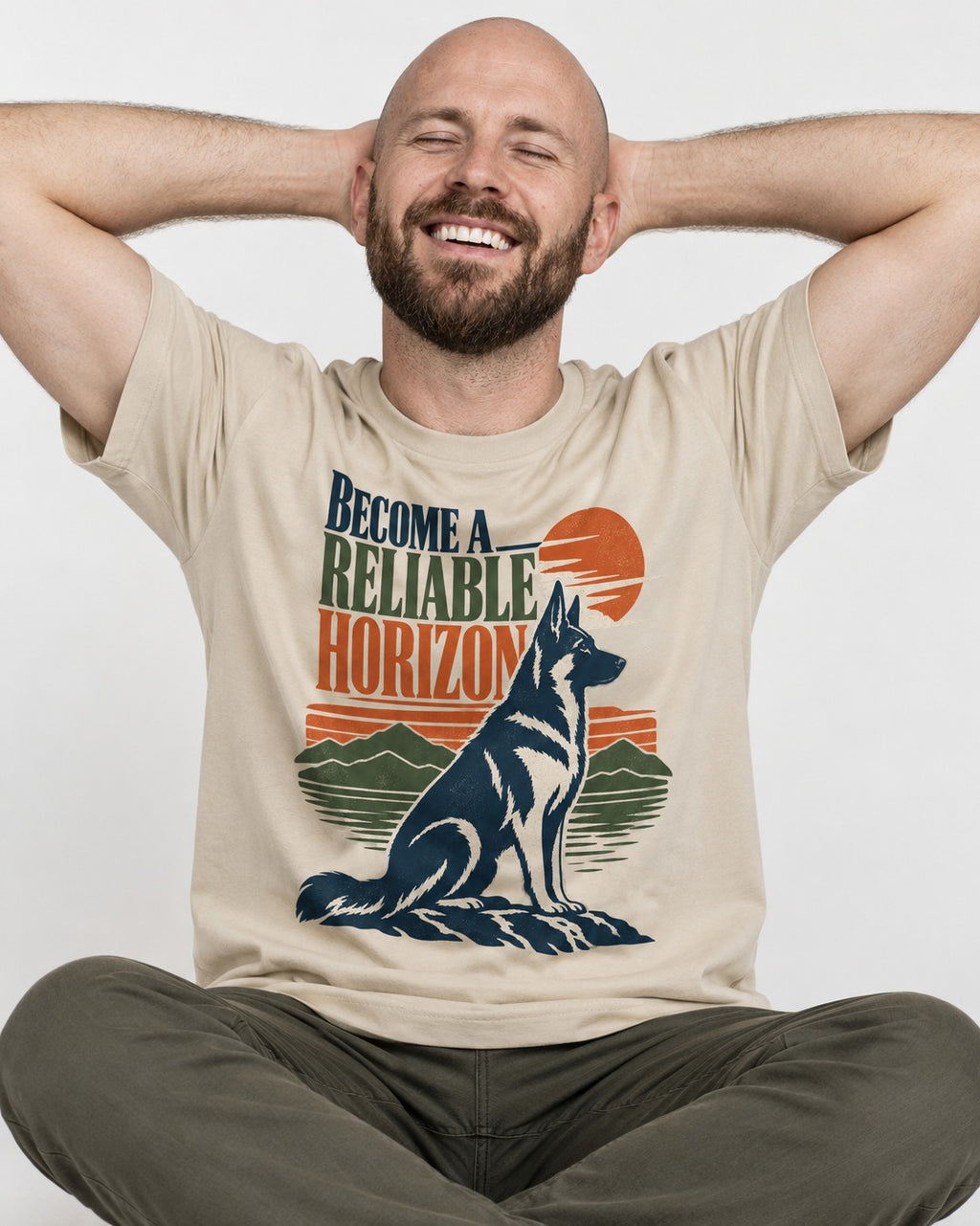 German Shepherd Dog Become a Reliable Horizon T-Shirt in Sand, worn by a seated model