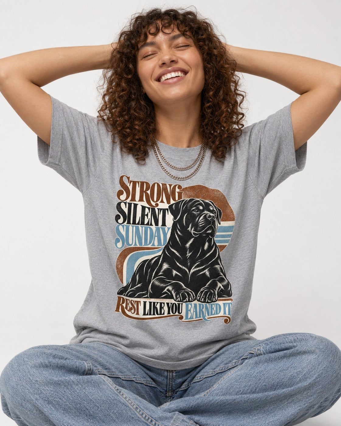 Strong Silent Sunday Rottweiler T-Shirt in Sport Grey, worn by a seated model
