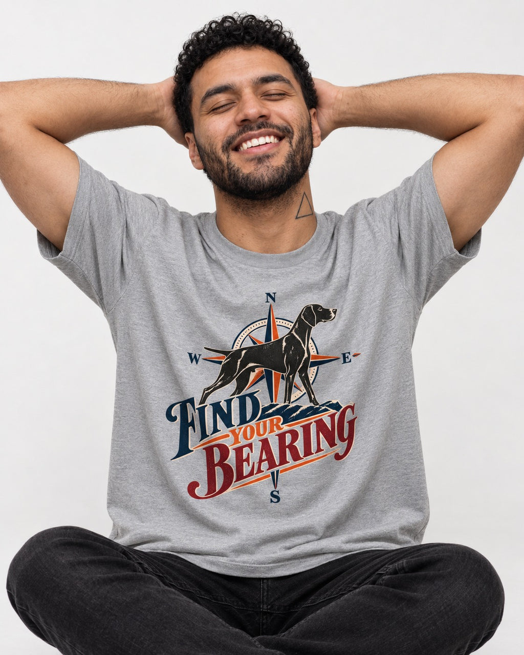 Find Your Bearing German Shorthaired Pointer T-Shirt in Sport Grey, worn by a seated model