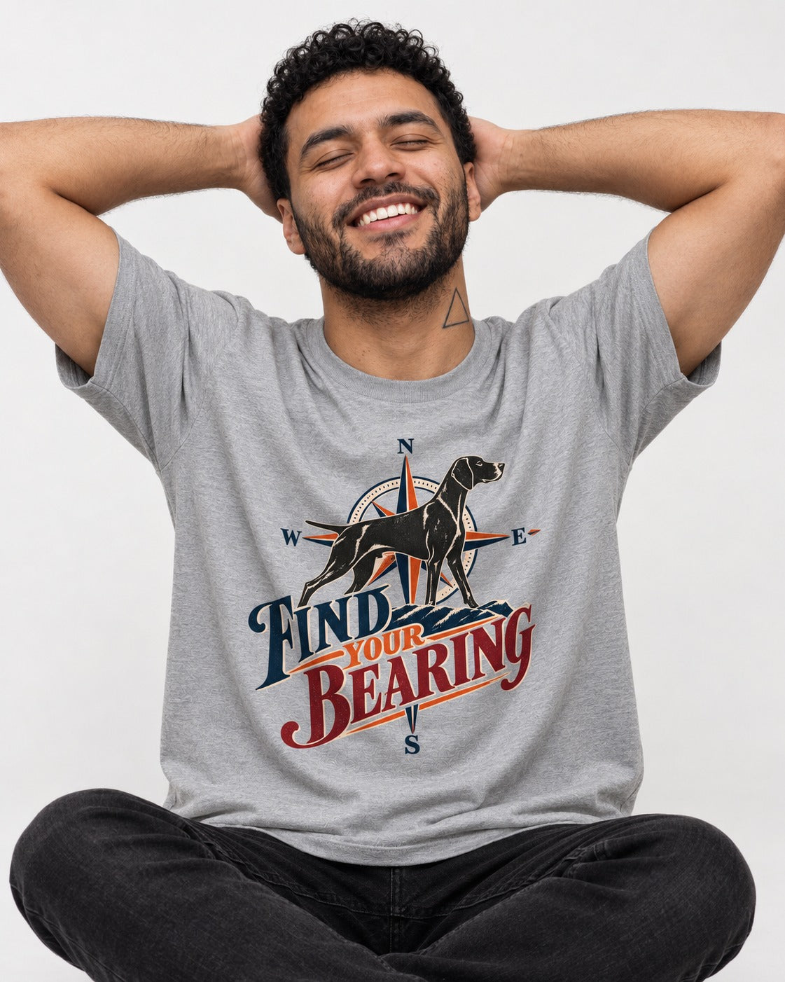 Find Your Bearing German Shorthaired Pointer T-Shirt in Sport Grey, worn by a seated model