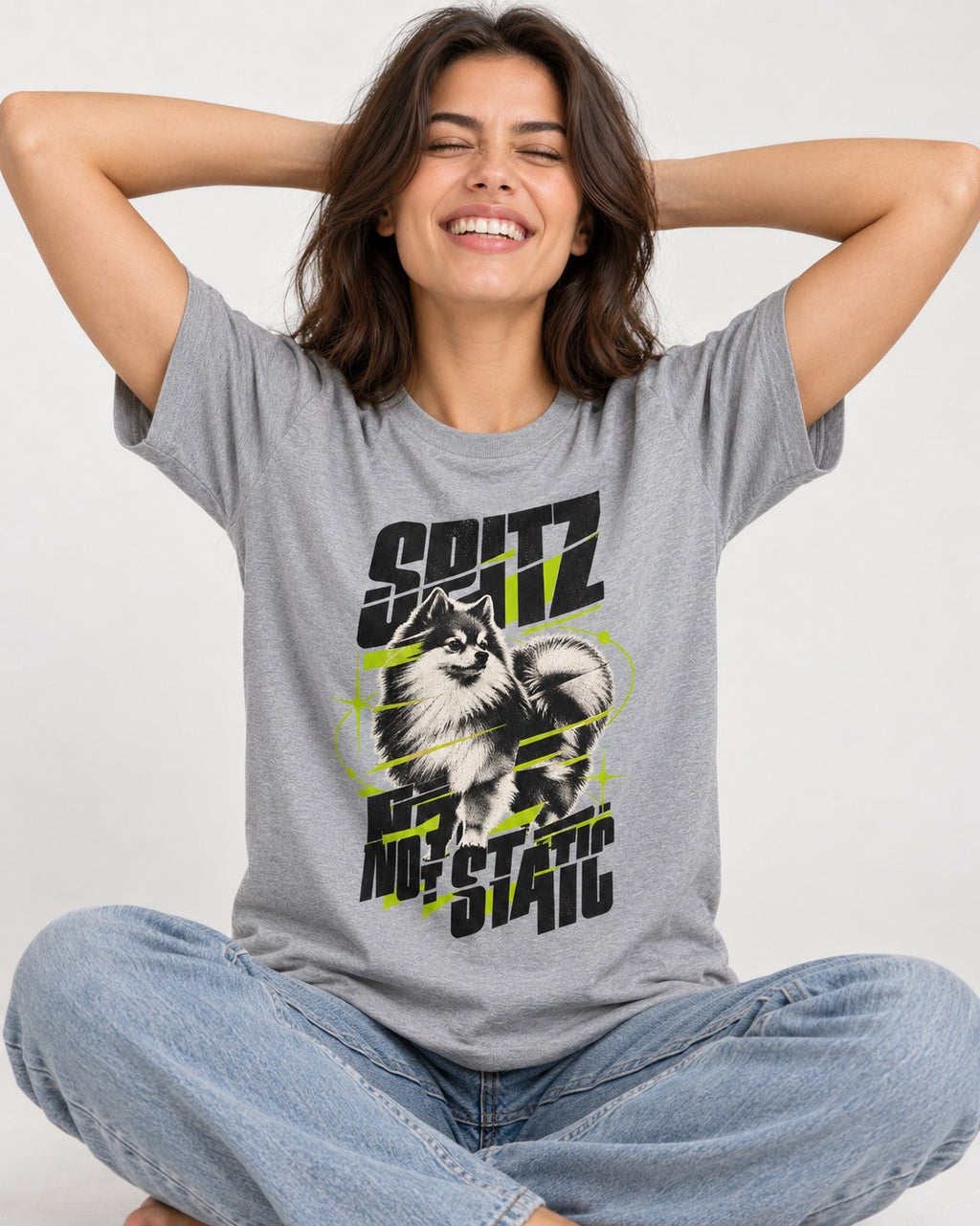 Pomeranian Not Static T-Shirt in Sport Grey, worn by a seated model