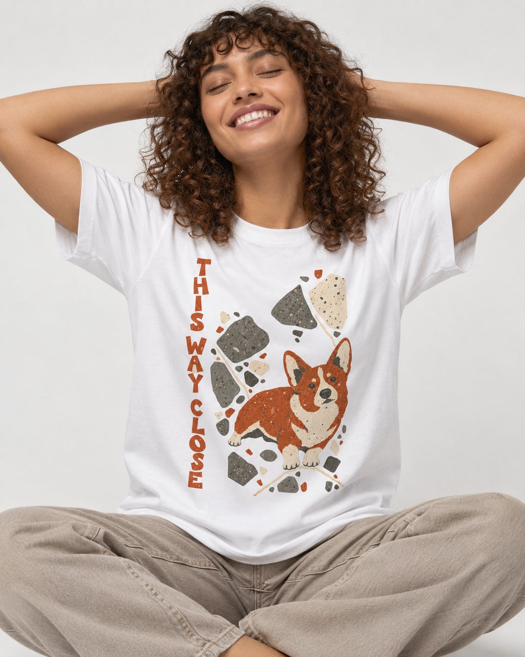 Corgi This Way Close Rubble Graphic T-Shirt in White, worn by a seated model