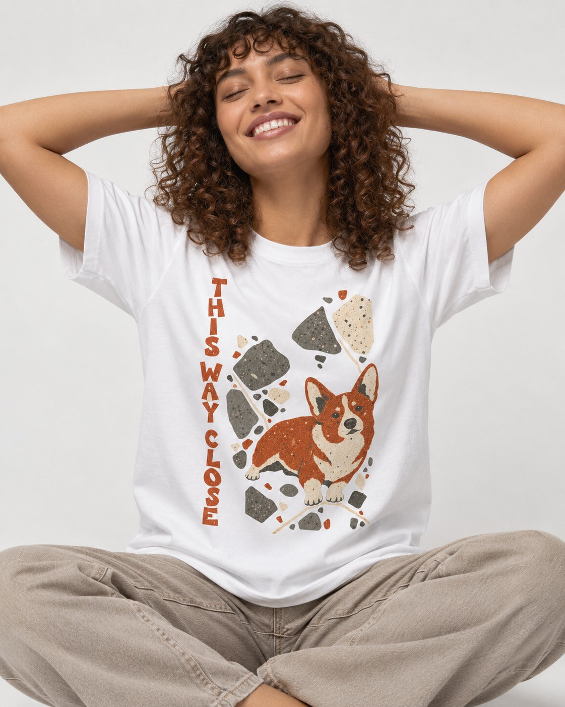 Corgi This Way Close Rubble Graphic T-Shirt in White, worn by a seated model