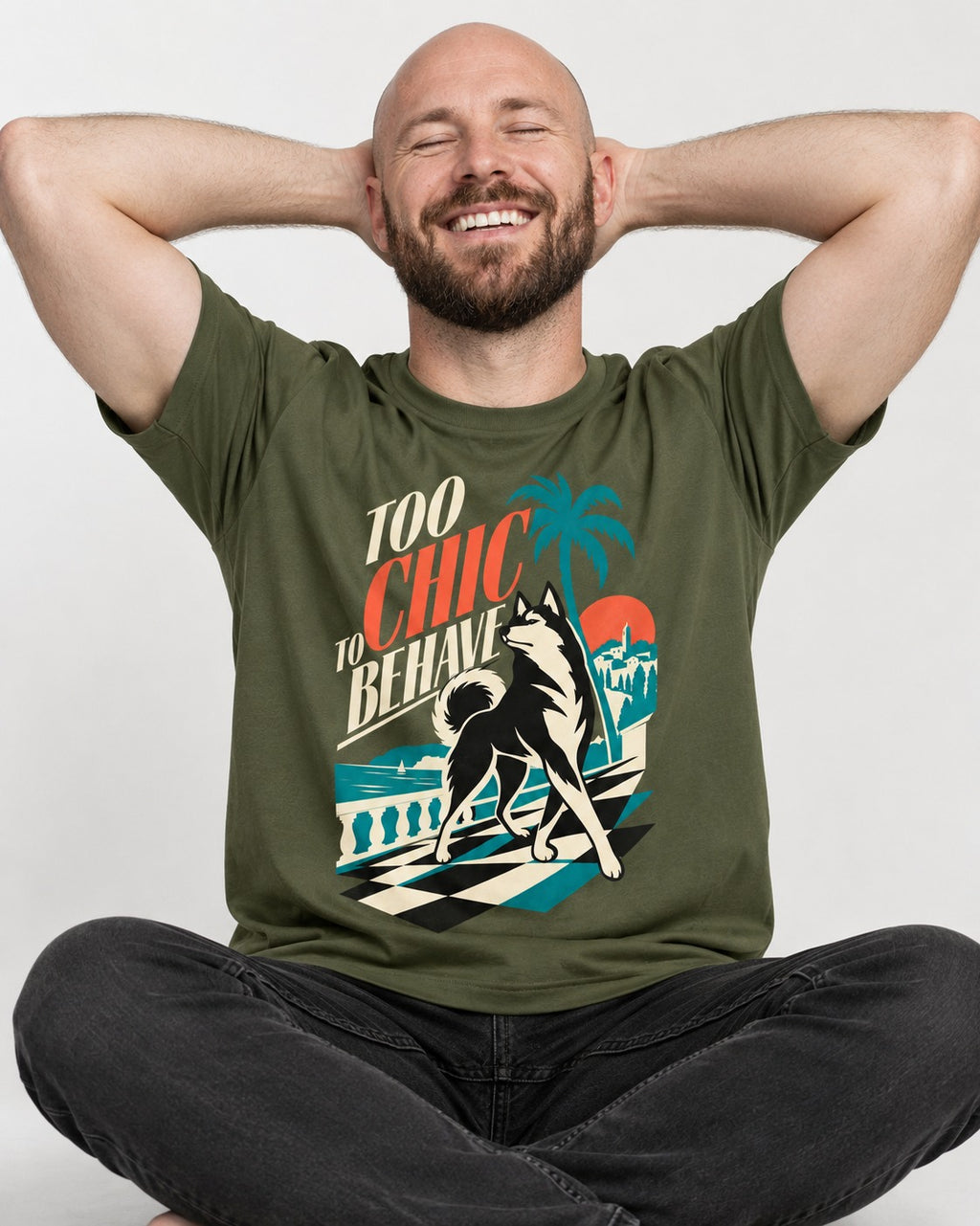 Husky Too Chic to Behave Riviera Graphic T-Shirt in Heather Military Green, worn by a seated model