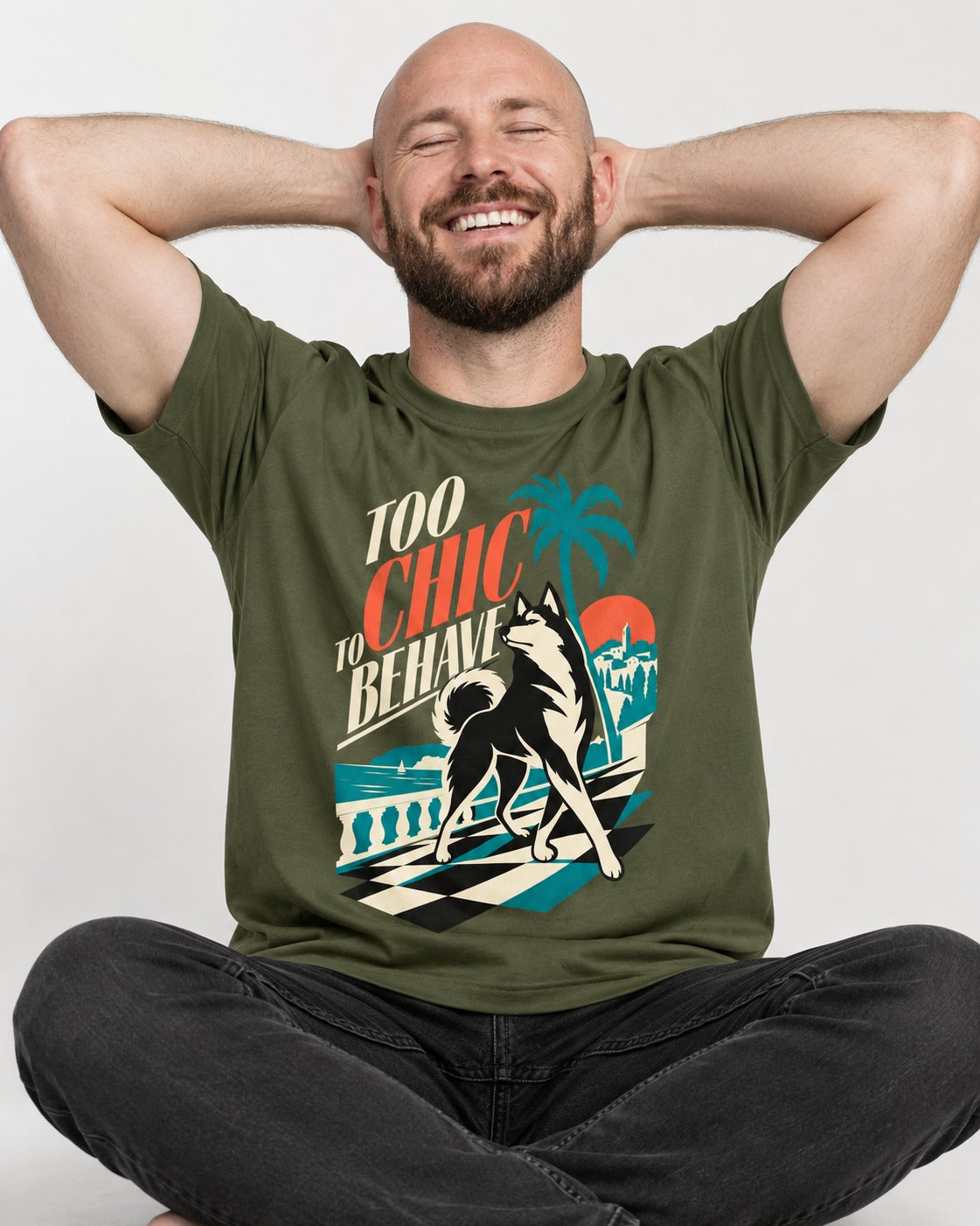 Husky Too Chic to Behave Riviera Graphic T-Shirt in Heather Military Green, worn by a seated model