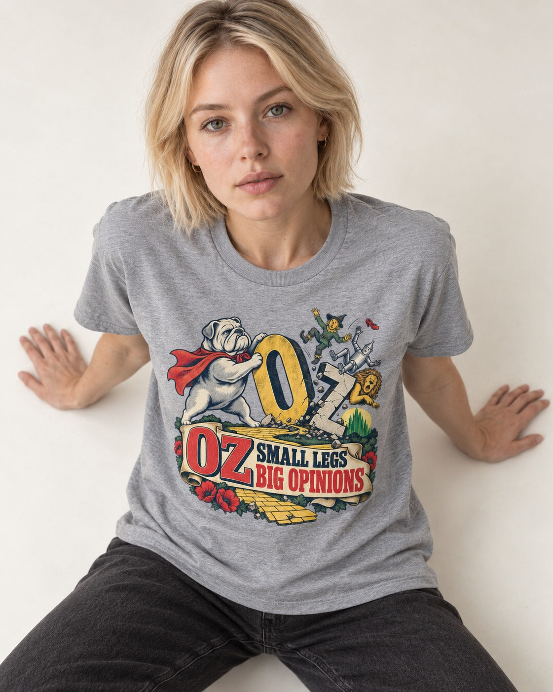 English Bulldog Small Legs Big Opinions T-Shirt in Sport Grey, worn by a seated model