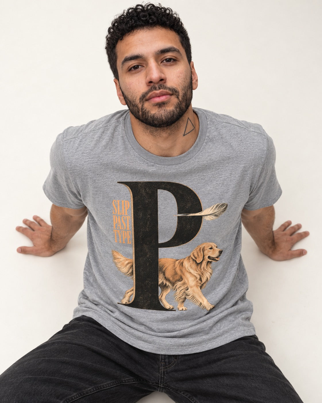 Golden Retriever Slip Past Type T-Shirt in Sport Grey, worn by a seated model