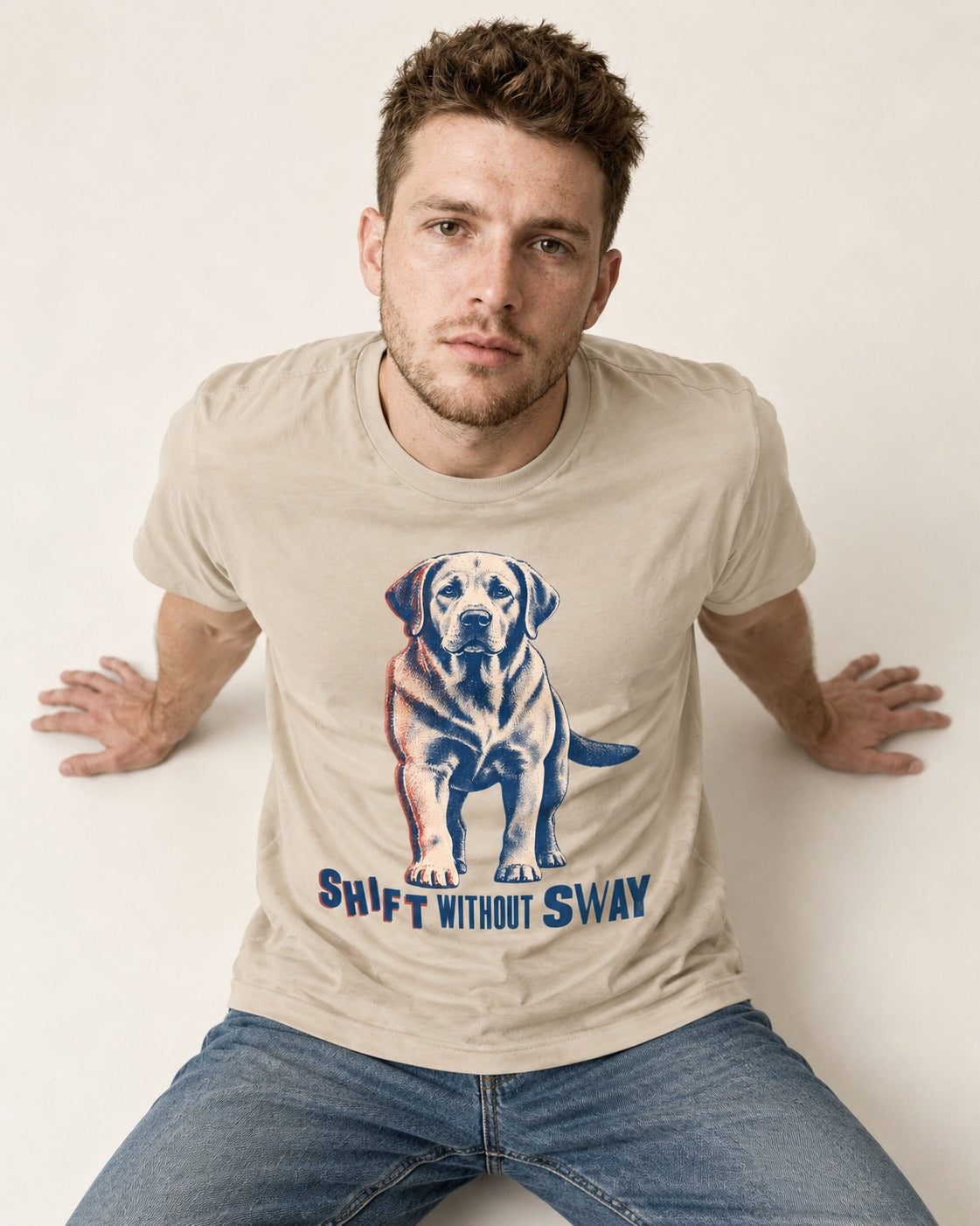 Shift Without Sway Labrador Retriever T-Shirt in Sand, worn by a seated model
