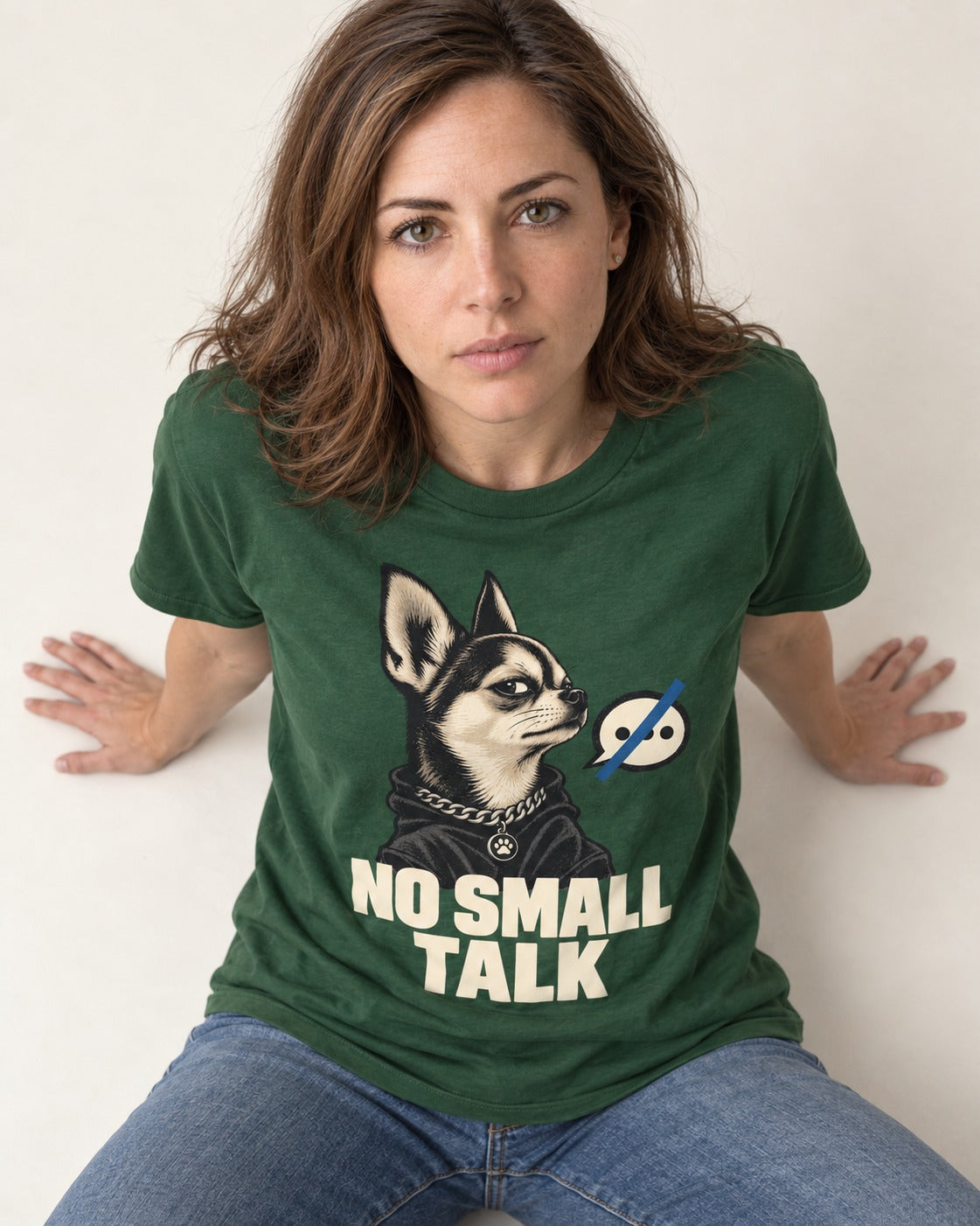 Chihuahua No Small Talk Speech-Off Portrait Graphic T-Shirt in Forest Green, worn by a seated model