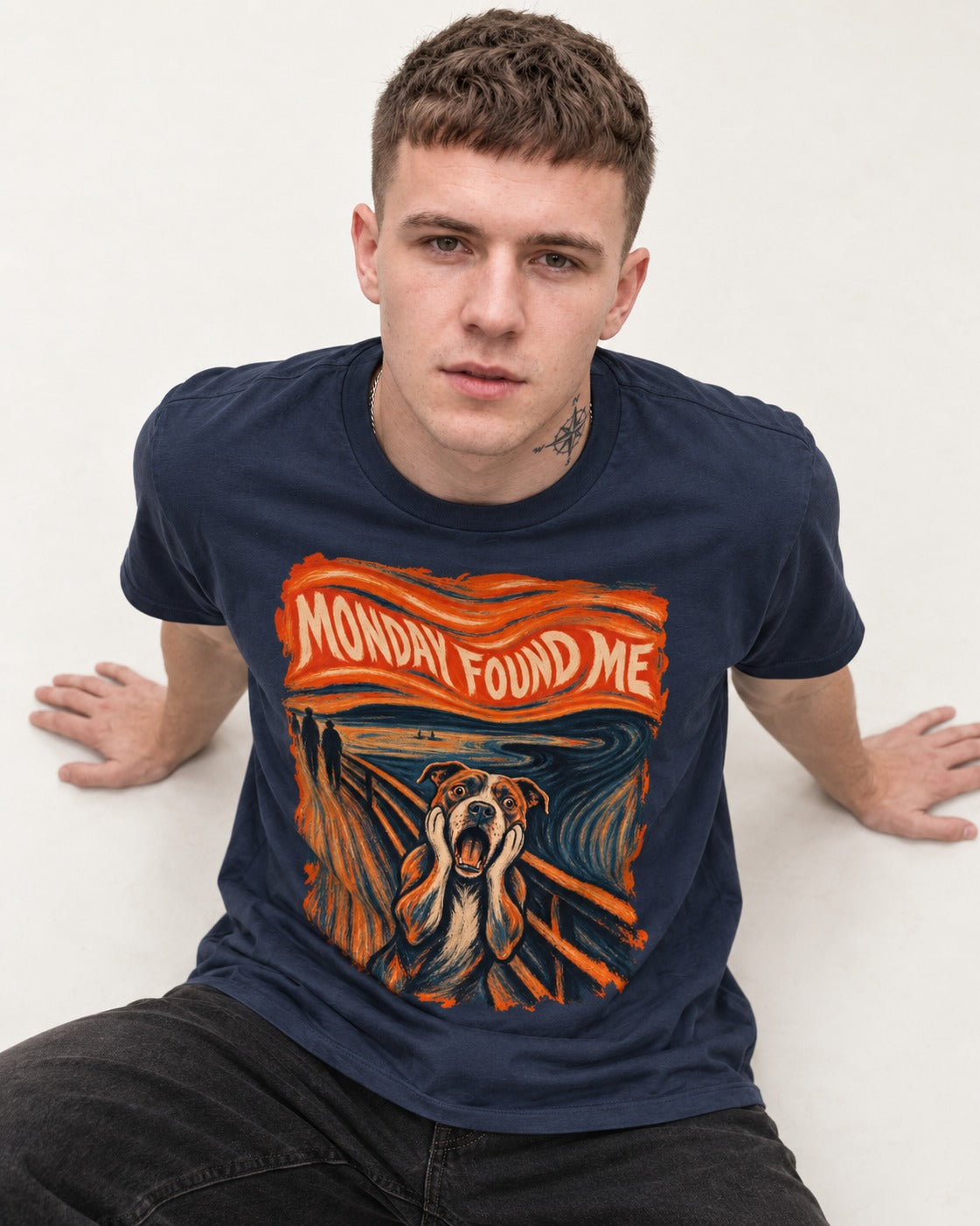 Pitbull Monday Found Me Expressionist Scream Graphic T-Shirt in Navy, worn by a seated model