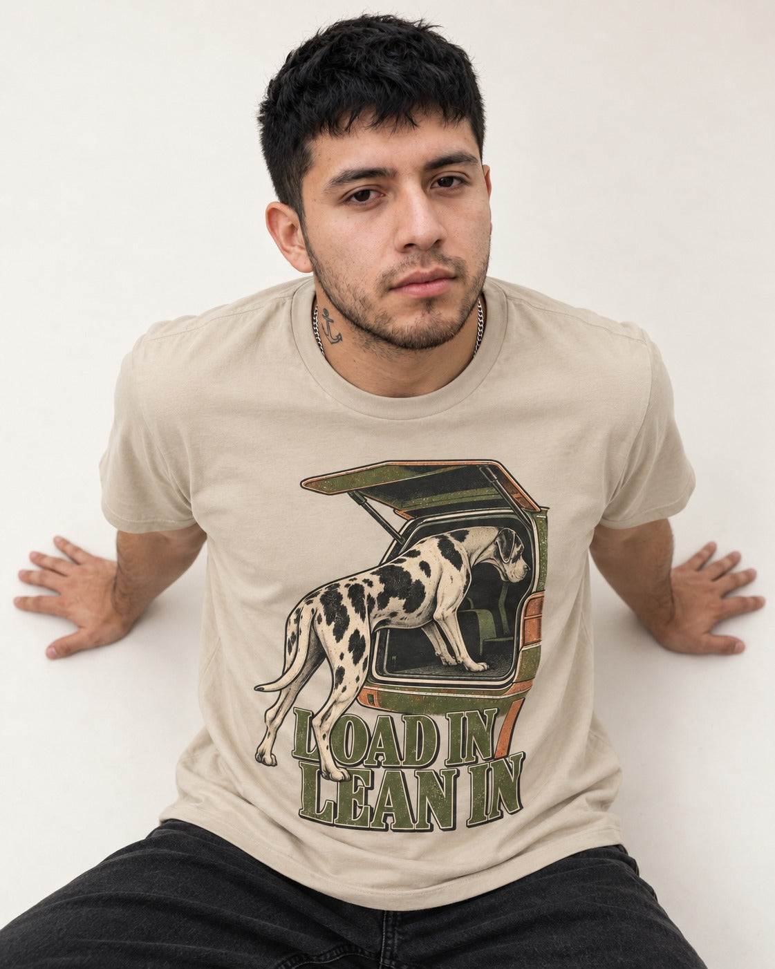Great Dane Loadin' Leanin' T-Shirt in Sand, worn by a seated model