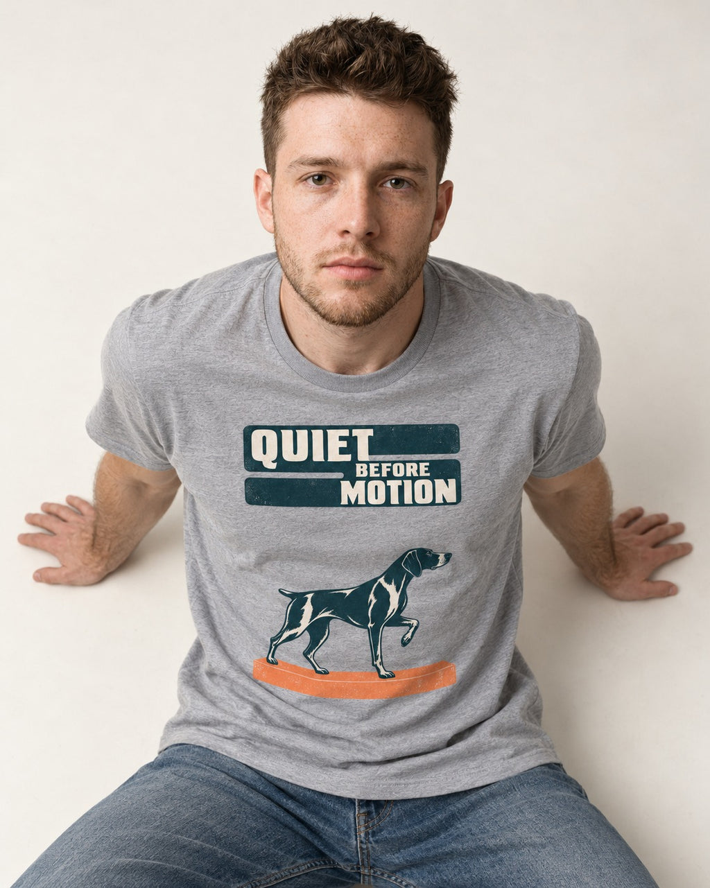 Quiet Before Motion German Shorthaired Pointer T-Shirt in Sport Grey, worn by a seated model