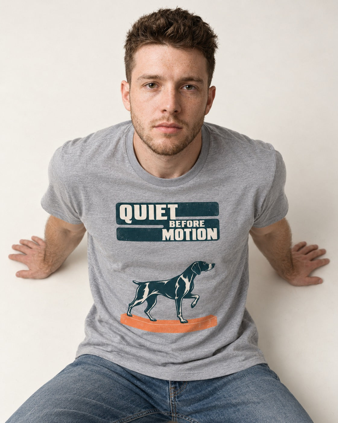 Quiet Before Motion German Shorthaired Pointer T-Shirt in Sport Grey, worn by a seated model
