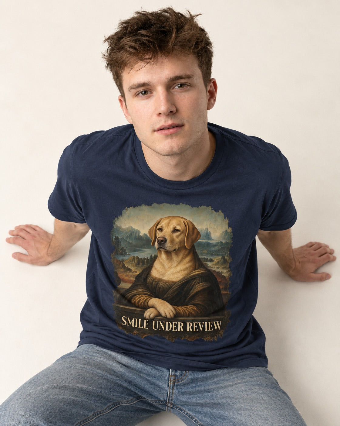 Labrador Retriever Smile Under Review Mona Lisa Graphic T-Shirt in Navy, worn by a seated model