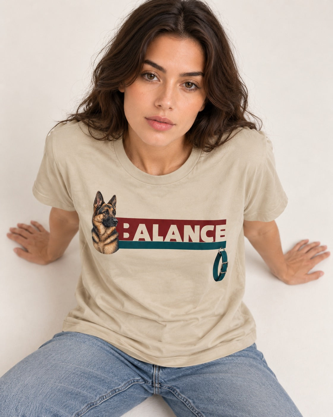 German Shepherd Dog Balance T-Shirt in Sand, worn by a seated model