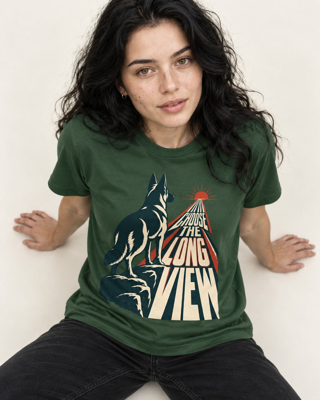 Choose the Long View Sunrise German Shepherd Dog Graphic T-Shirt in Forest Green, worn by a seated model