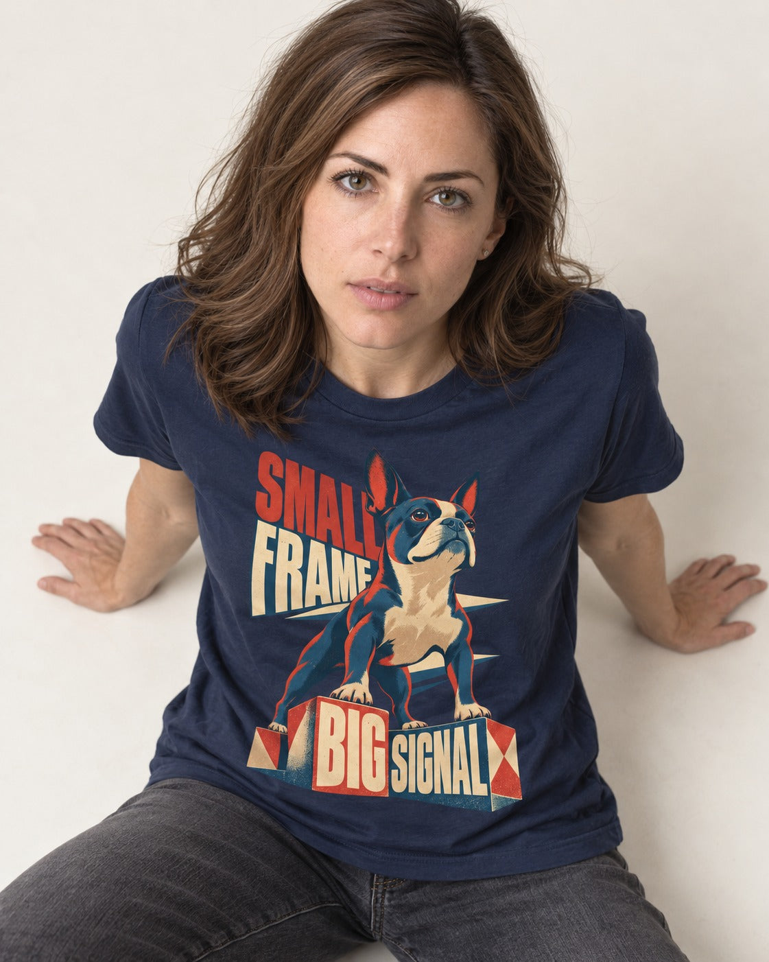 Small Frame Big Signal Boston Terrier T-Shirt in Navy, worn by a seated model