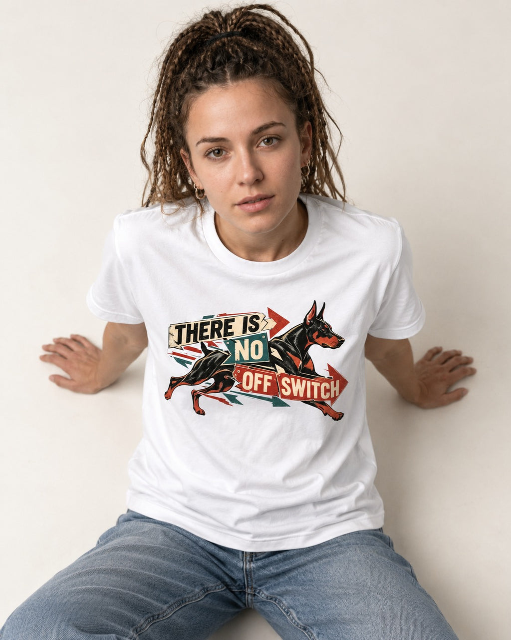 Doberman There Is No Off Switch Arrow Sprint Graphic T-Shirt in White, worn by a seated model