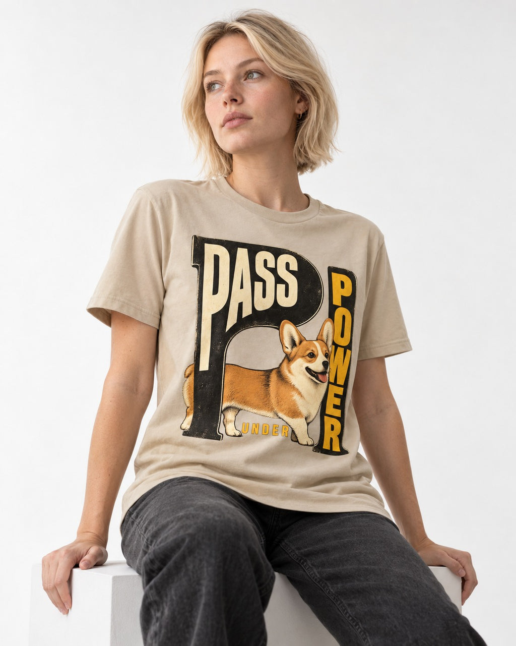 Corgi Power T-Shirt in Sand, worn by a seated model