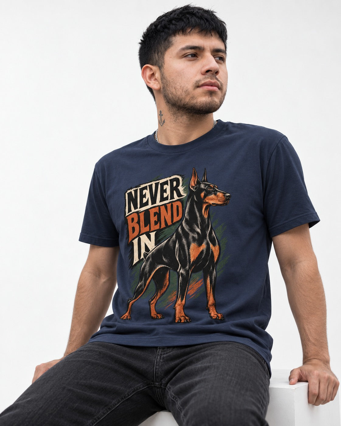 Doberman Never Blend In Brush Graphic T-Shirt in Navy, worn by a seated model