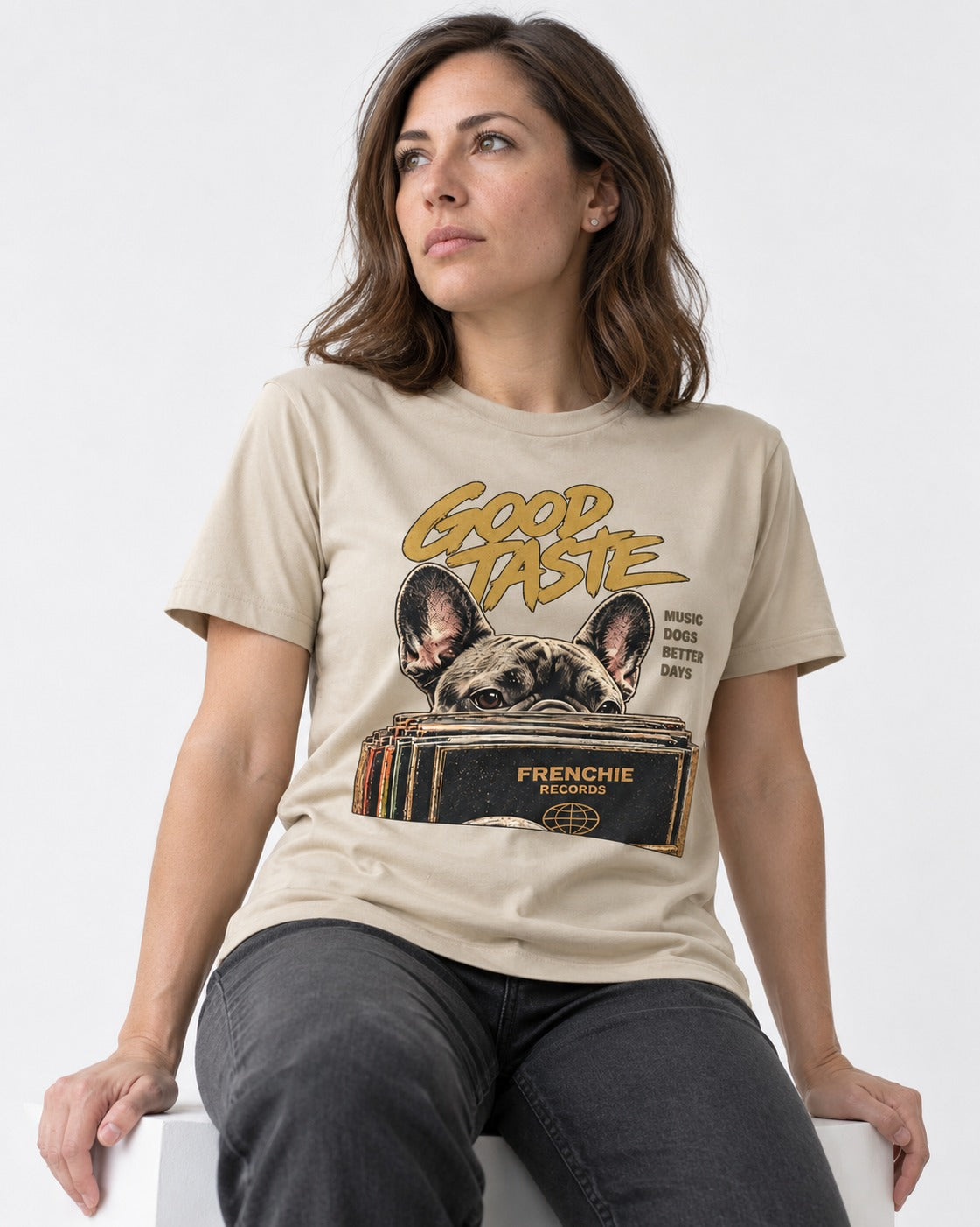 Frenchie's Good Taste T-Shirt in Sand, worn by a seated model