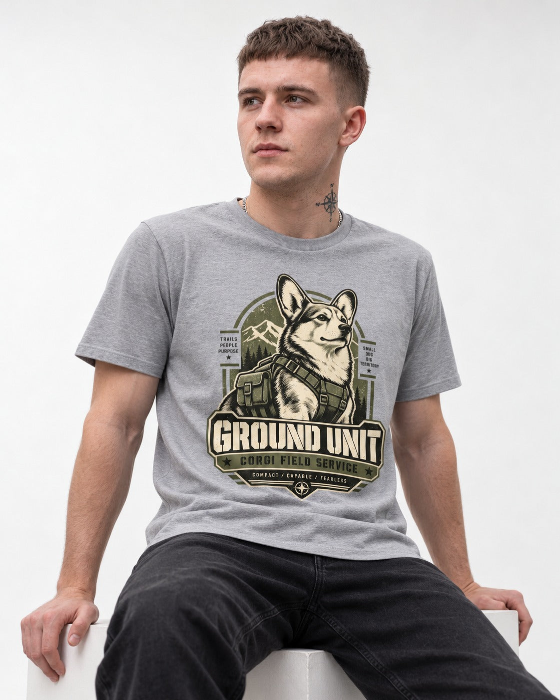 Corgi Ground Unit Field Service Badge T-Shirt in Sport Grey, worn by a seated model