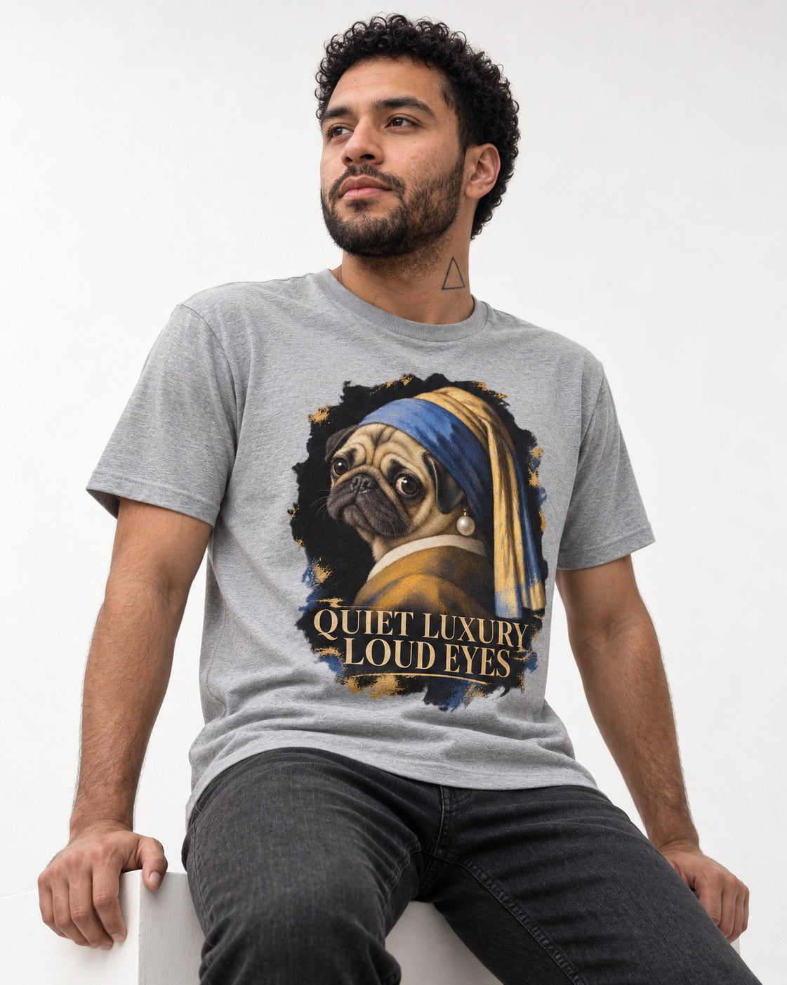 Pug Quiet Luxury Loud Eyes Pearl Portrait Graphic T-Shirt in Sport Grey, worn by a seated model